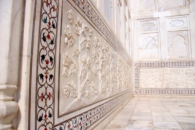 Lower walls of the tomb are white marble dados that have been sculpted with realistic bas relief depictions of flowers and vines