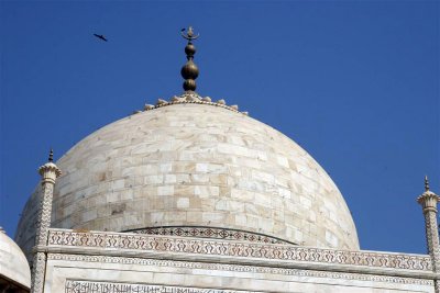 The finial is topped by a crescent moon, a typical Islamic motif.