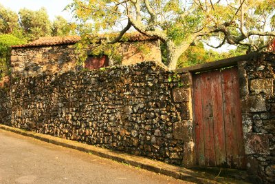 Stone adega behind wall, Azores