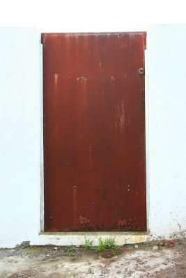 Metal door painted rust color.  Clever.