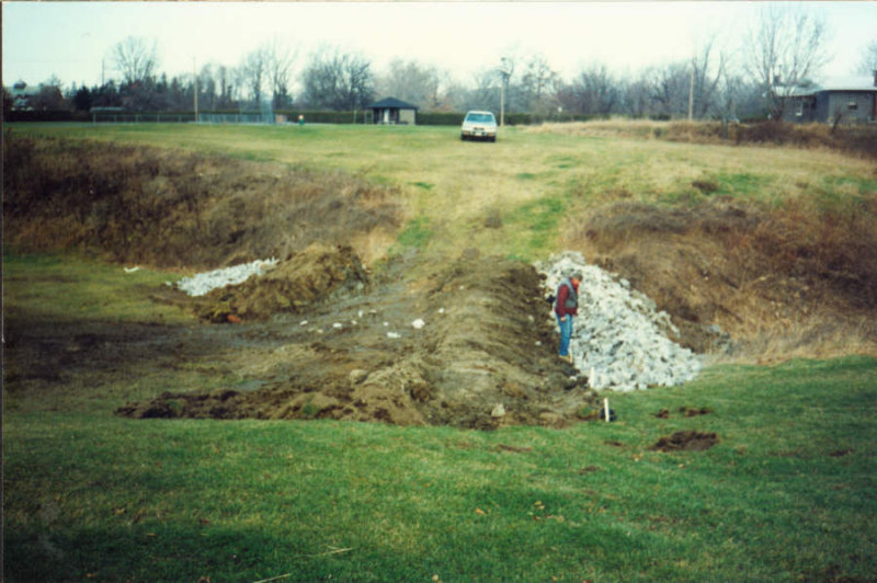 Constructing the dam at the east end of the pond, October, 1991