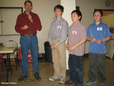 Jeff Skevington presenting prizes for Macoun Club exhibits to the Jason-Byerley brothers