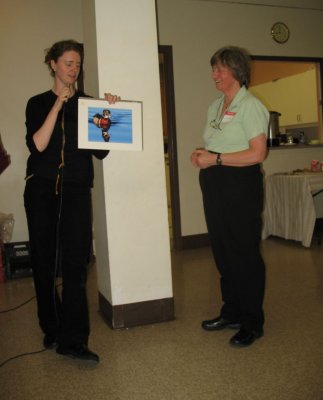 Diane Lepage (R) receives first prize for her photograph of a male wood duck