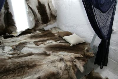 Double bed with fur from reindeers