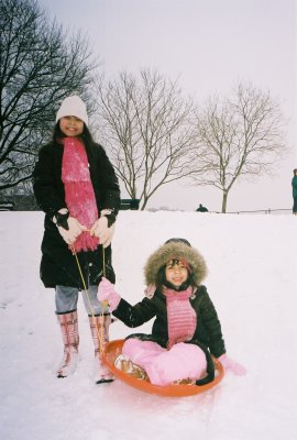 Johanna and Christina sledding in Inwood Hill Park, NYC.