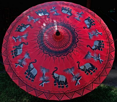 Large umbrella with elephants and bamboo