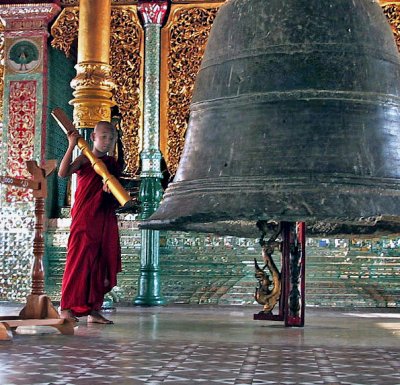 Young monk rings bell