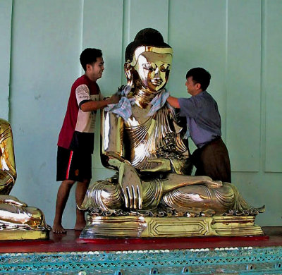 Polishing a Buddha image