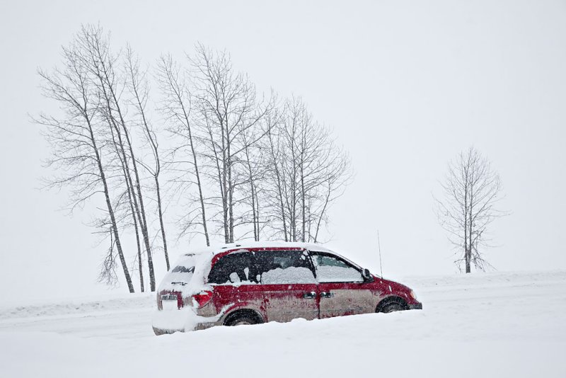 Vehicle along river bank in snow 2010 January 4th