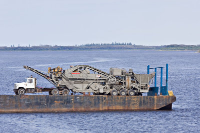 Rock crusher heading out on barge