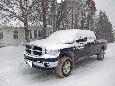 Truck under new snow