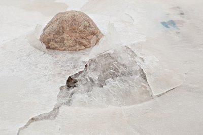 Rocks breaking through the ice