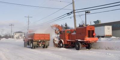 Snow removal with orange truck