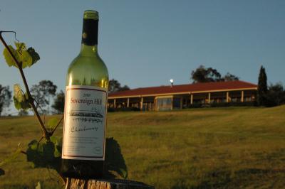 An (empty) bottle of Souvereign Hill wine and our lodge in the background ! (and on the label)