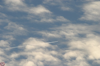 Arrow through field of clouds