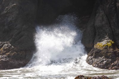 Waves crashing through the channels under the seabird-nesting rock