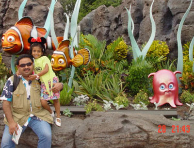 Dad and Uma in Epcot with Nemo hovering in the background!