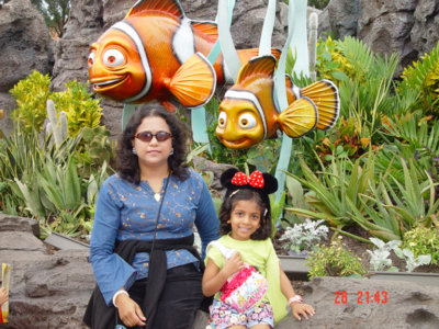 Uma with Mom at Epcot with Nemo breathing down!