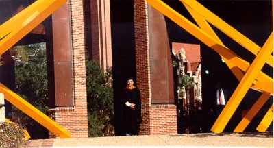 The proud Graduate poses at a University of Florida landmark for posterity.