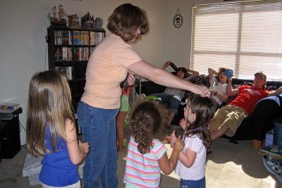 Jen passing out more fun things at Courtney & Don's apartment.