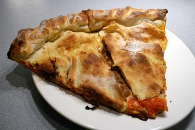 stuffed meatball pie with roma tomatoes and basil