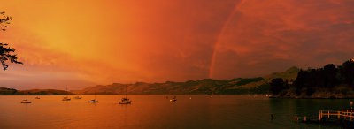 Rainbow at sunrise, Corsair Bay, Lyttelton Harbour, New Zealand