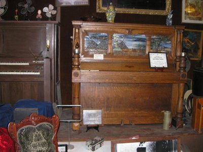 Antique player pianos in the General store