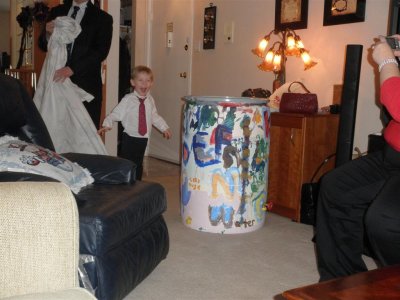 Zach showing Rolf & Granny the painted rain barrel