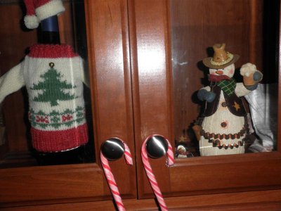 wine bottle and cowboy snowman decorate our cabinets