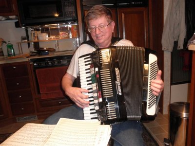 Rolf  practices his accordian in the RV