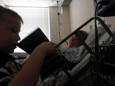 Zach reading book to Baby Joshua