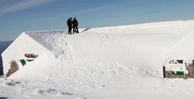 Hard to find the benches under all that drifted snow!  Judy, Kirk and Cooper enjoying a view from the top.