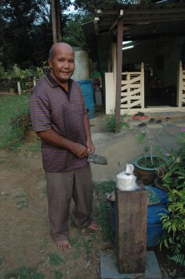 Man preparing coconut drink 