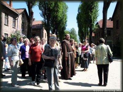 A priest leading a group of tourists