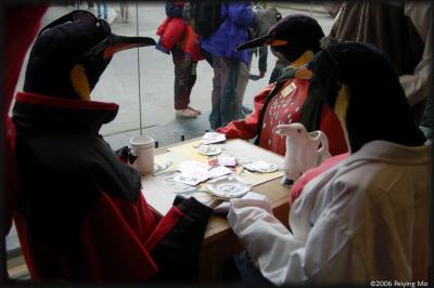 Outdoor clothing stores use stuffed penguins as their mannequins