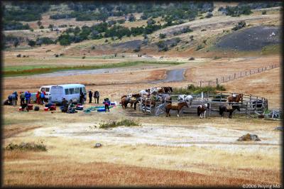At Laguna Azul camp ground, people are getting ready for horseback riding.