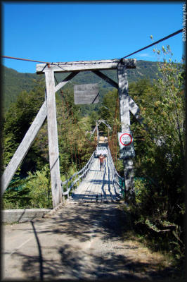 The bridge over Rio Futaleufu has a weight limit of 1100lbs: so the passengers follow the truck to cross to the other side