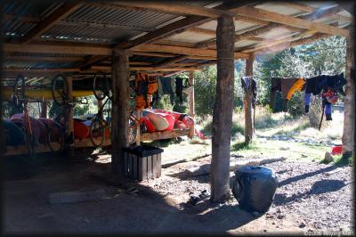 A shed filled with kayaks, bikes and wetsuits.