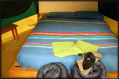 Our 'camping' tent comes with all the basic stuff, like a table, mattress, sheets, blankets, towels, etc