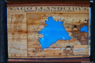 Map of the lake region carved on wood: Puerto Varas is on the bottom left.