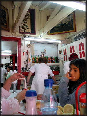 Before we find out the price (on the black board), we are situated at a small table shared with other diners.