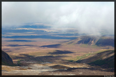 The fast moving clouds form interesting shadows over the valley