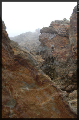 More steep hike between boulders and uneven terrain