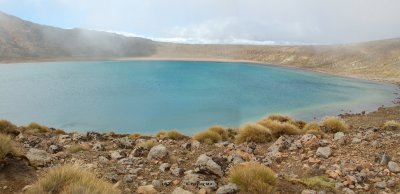 On the right of the path is the Blue Lake, almost grayish under the cloudy sky