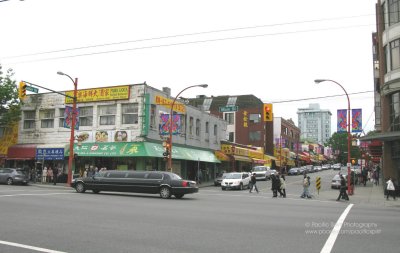 Black limo gliding by on Main at Keefer, Vancouver's Chinatown