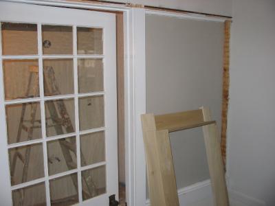 Entrance - stained glass on the right (where the drywall is), plain colored glass on the door.