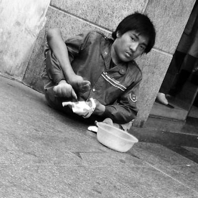 Most likely artificially mutilated beggar, Zhongshan, China