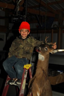 8 year old Wyatt Conyers with his first  buck