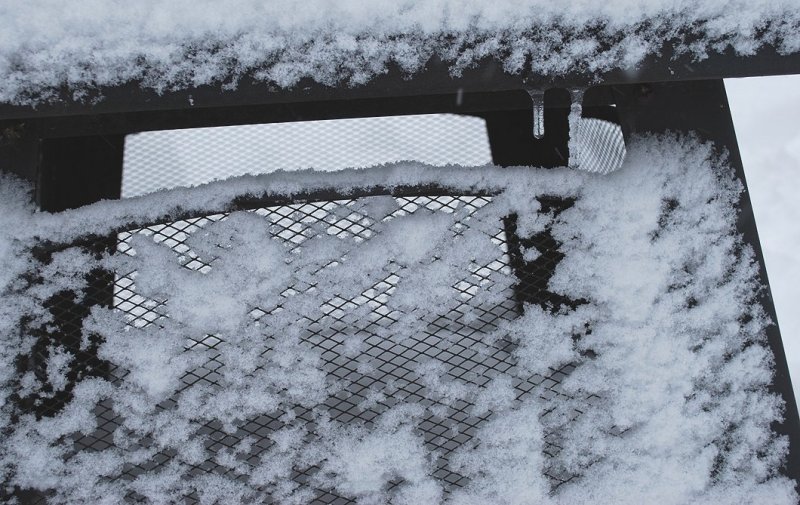 Snow On Chimney Grate