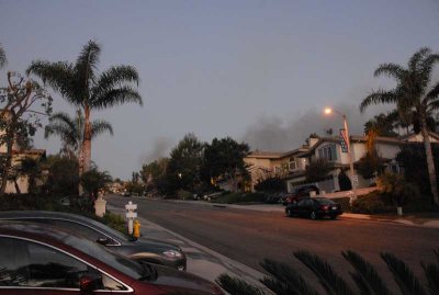 Tuesday 6:30AM fire behind houses up the block